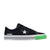 Green and black trainer shoe on a white background
