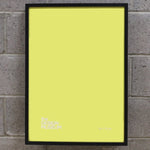 Yellow picture frame on a birck wall