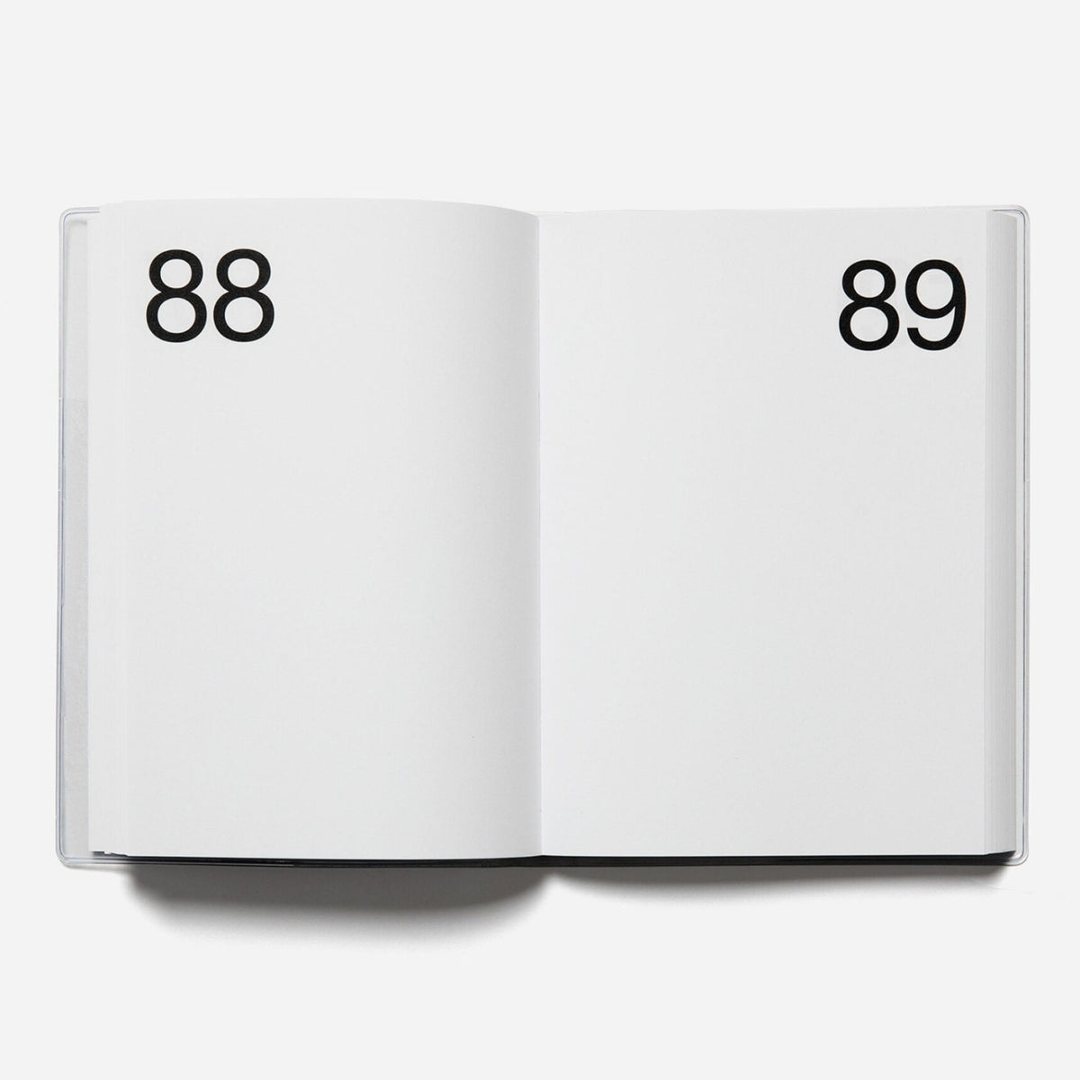 Open planner with pages numbered 88 and 89 on a white background