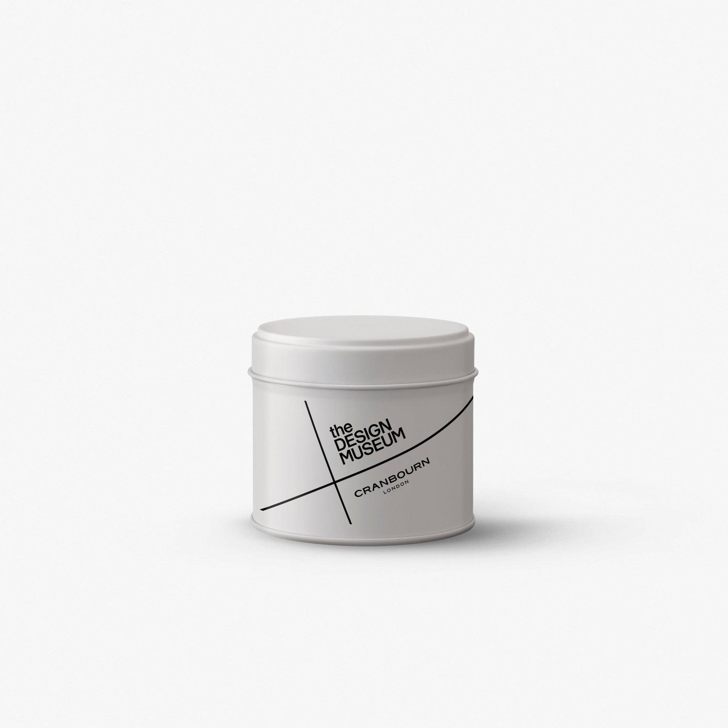 A white cylindrical tin with a matching lid, featuring black minimalist text and line graphics on the front, set against a clean white background.