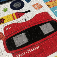A closeup view of a 1980s themed jigsaw puzzle featuring colourful illustrations of 80s objects.