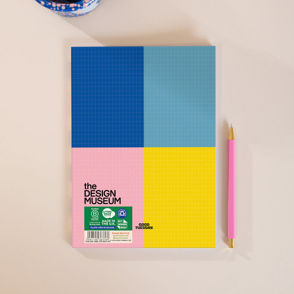 Back of a colourful notebook on a beige table