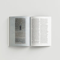 Ai WeiWei catalogue open pages black text on a light gray background 