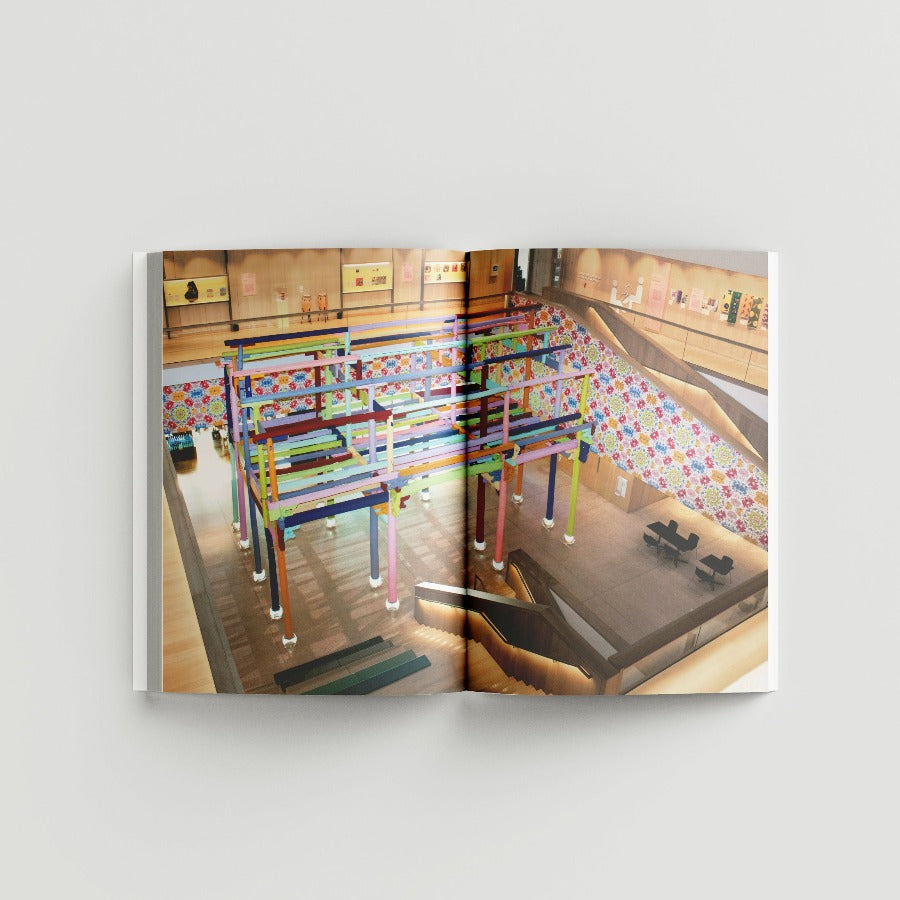 Inside page of Ai Weiwei catalogue with a photogaph of a colourful scultpure inside the Design Museum.