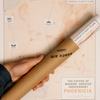 Hand holding a rolled-up map with 'Air Korda' branding on a beige background