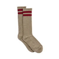 A pair of ribbed knit crew socks in a heathered taupe-beige color, featuring two horizontal dark red stripes near the top cuff, displayed against a clean white background.