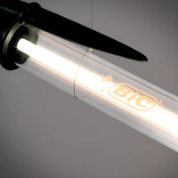 Black BIC pen lamp on a gray background