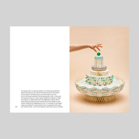 Inside page of Bethan Laura Wood catalogue featuring a three-tiered paper cake with decorative elements on a beige background