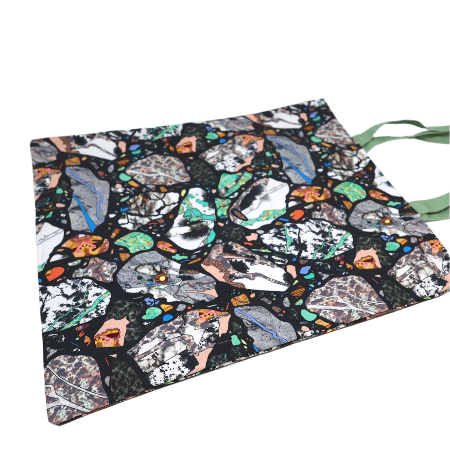 A colourful marbled abstract tote bag with a green handle on a white background