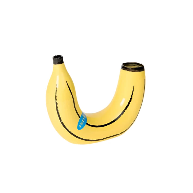 Yellow banana shaped vase on a white background.