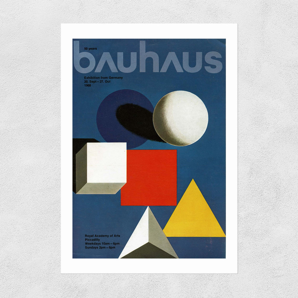 A print of the cover of a 1968 Bauhaus magazine with a geometric design using various colourful shapes on a blue background and 'bauhaus' in bold letters.