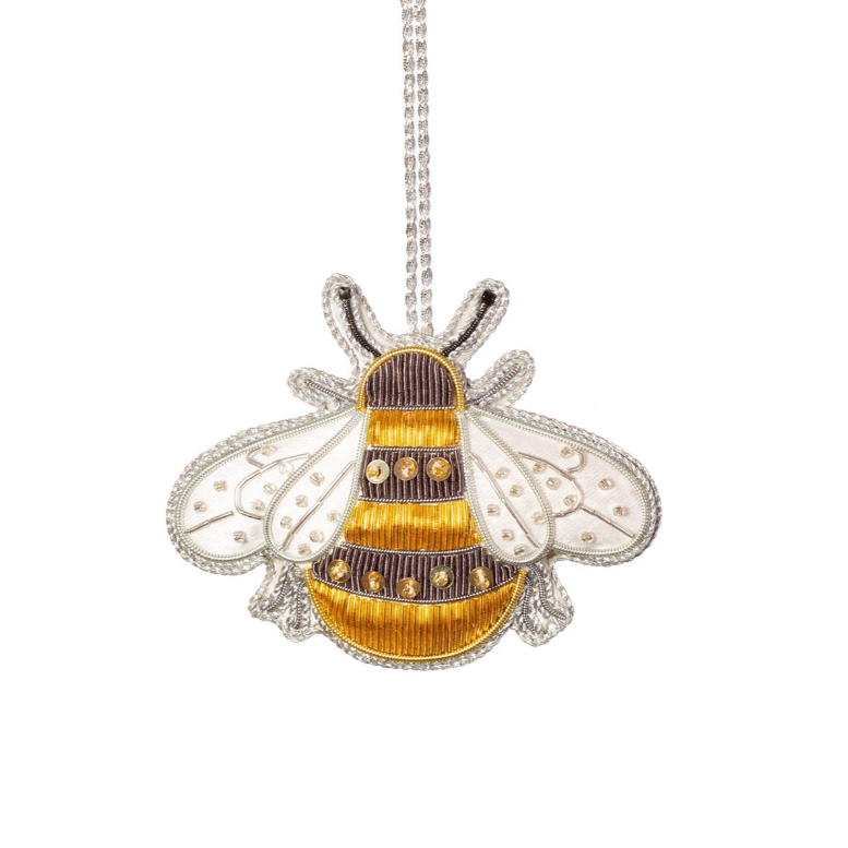 Bee-shaped pendant necklace on a white background