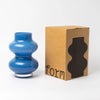 Blue Cornflower Glass Vase - 25cm picture of vase that looks like the Michelin Man on white background with its packaging box that is written form on it