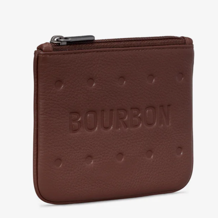 A bourbon biscuit shaped leather purse on a white background.