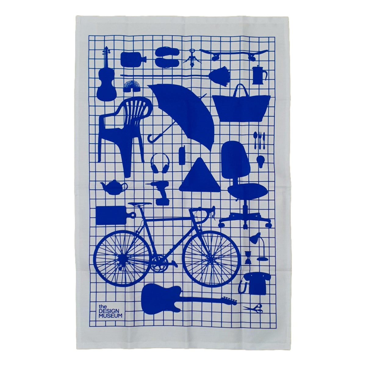A white Tea towel with blue graphic design of everyday objects on a blue grid.