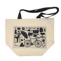 picture of an off white tote bag with black handle featuring a monochromic printed image of the crowdsourced wall of the design museum.