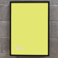 Yellow picture frame on a birck wall