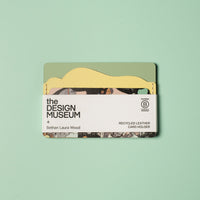 Recycled leather card holder with 'The Design Museum' branding on a light green background