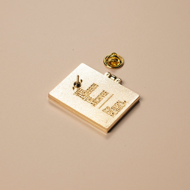 Gold badge with text on a beige background