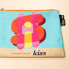 Colorful pouch with 'kiss' design and Harland Miller branding on a beige background