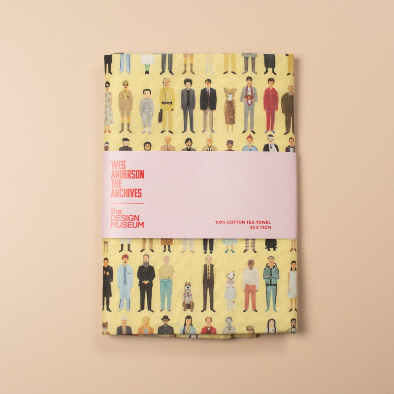 Book with a cover featuring a pattern of people on a beige background