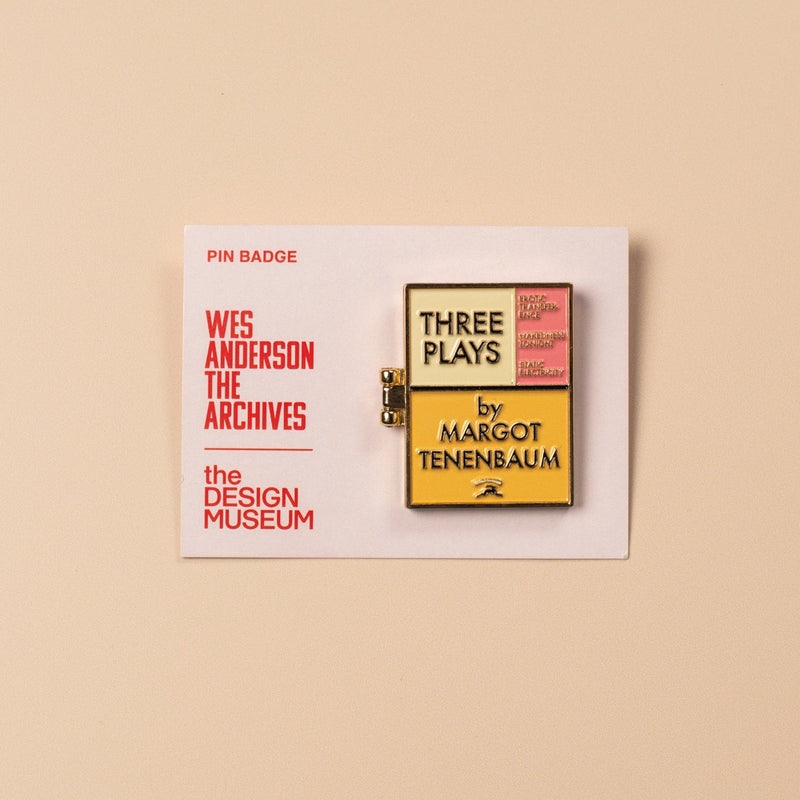 Pin badge with text on a beige background