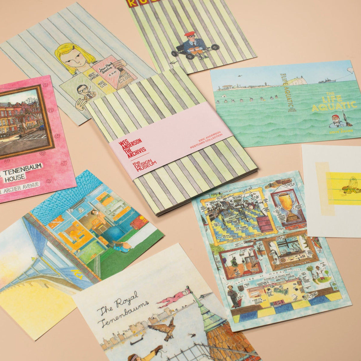 Collection of vintage postcards on a beige surface