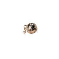Silver charm with a textured ball on a white background