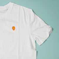 White t-shirt with a small logo on a two-tone background