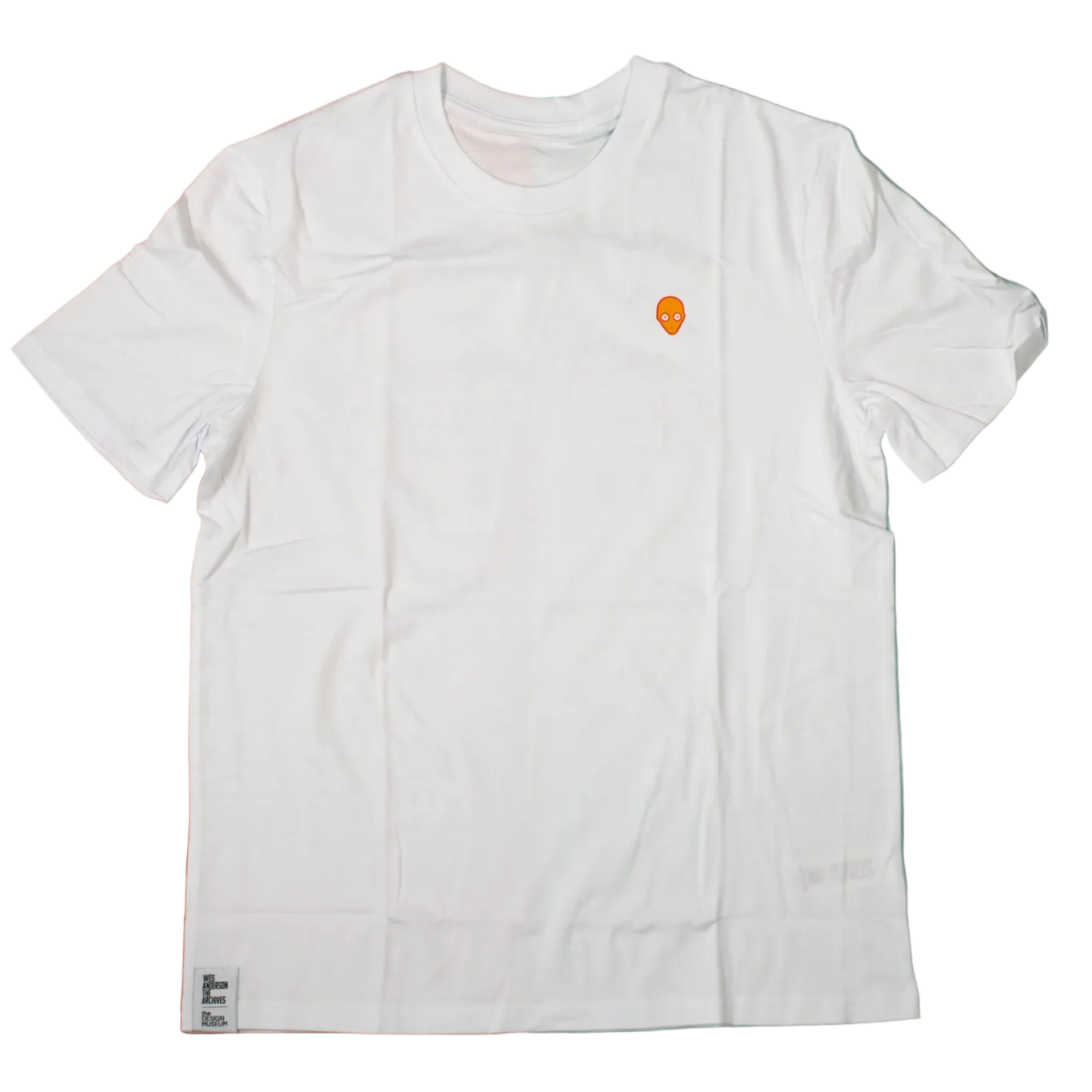 White t-shirt with a small logo on a two-tone background