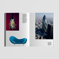 Open book with images of a blue chair, a person, and a cityscape on a gray background
