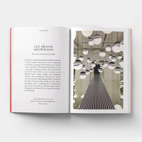 Open page of Design London book featuring a photograph of a room with lots of mirrors and hanging spherical lights.
