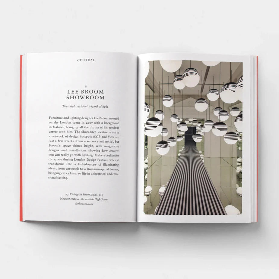 Open page of Design London book featuring a photograph of a room with lots of mirrors and hanging spherical lights.
