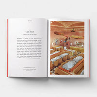 Open page of Design London book featuring a photograph of a brightly lit orange restaurant.