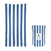 Dock & Bay Towel white and blue stripes laid flat with its bag on white background.