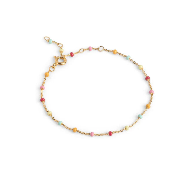 A delicate gold chain bracelet adorned with small, pastel beads in pink, yellow, light blue, and white, displayed on a clean white background.