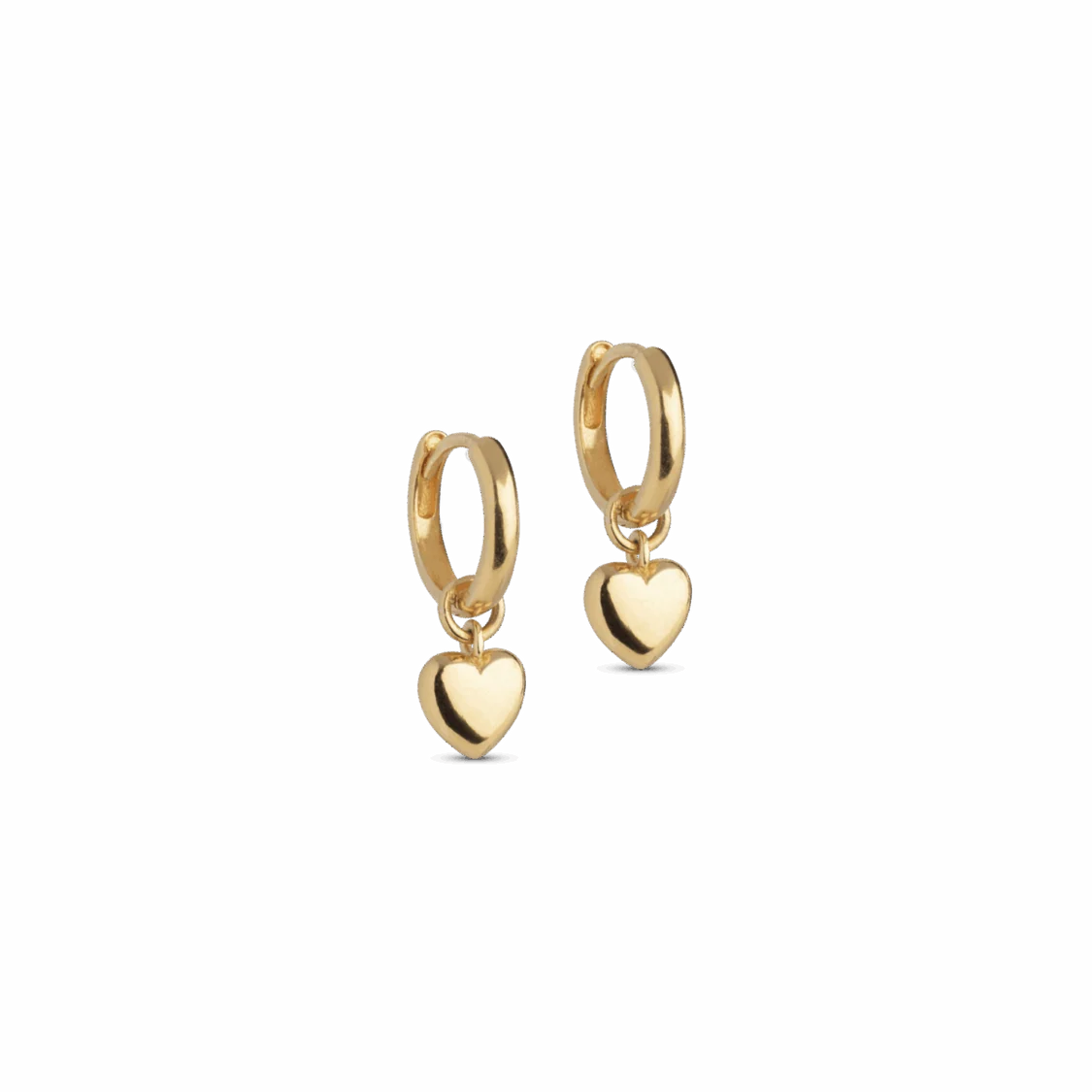 A pair of gold huggie hoop earrings with a small dangling heart charm, shown on a plain white background.