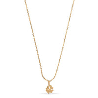 Gold necklace with a clover-shaped pendant on a white background