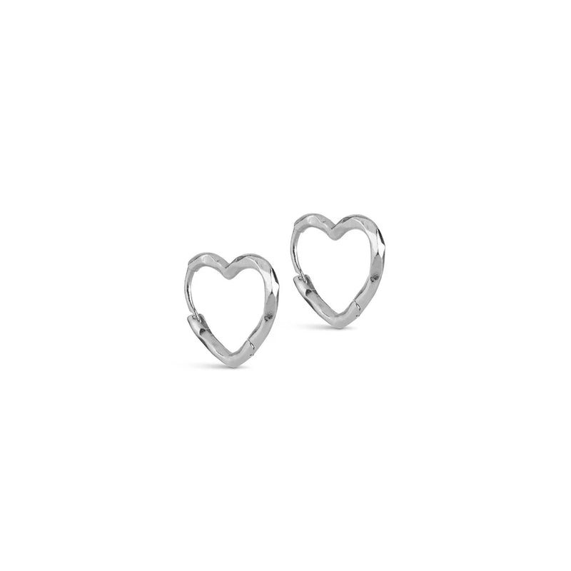 A set of silver heart shaped hoop earrings on a white background
