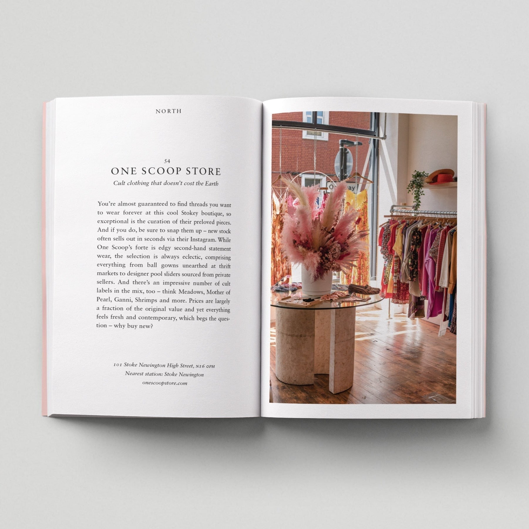Open page of Eco London book featuring a photograph of One Scoop clothing store with lots of colourful clothes.