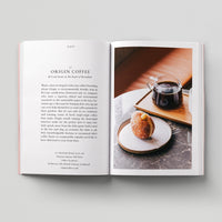 Open page of Eco London book featuring a photograph of a jug of coffee and a pastry.