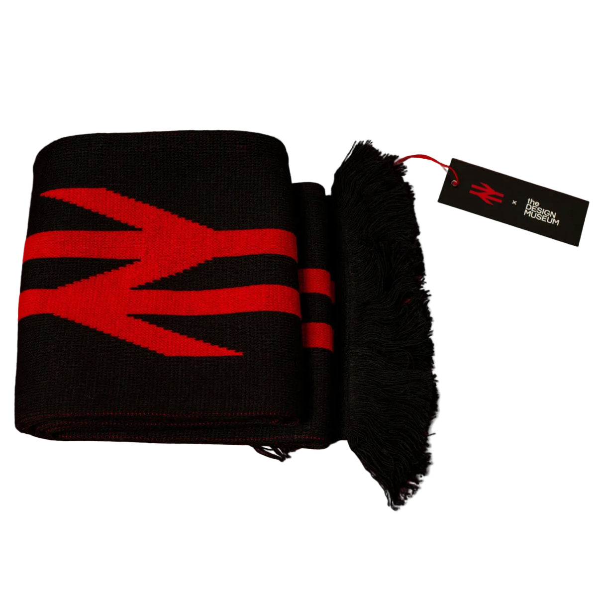 A folded black knit scarf with a bold red geometric logo pattern, featuring a fringed edge and a black hangtag, set against a solid red background.