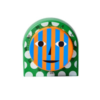 A colorful kitchen timer with an abstract face design on a white background