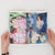 hands holding a fashion zine open