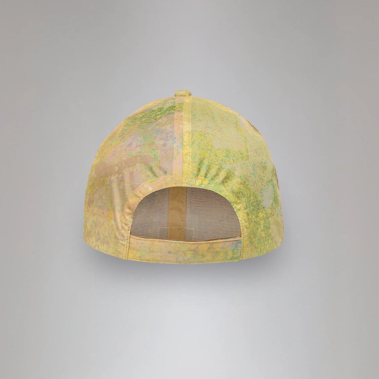 Yellow cap with mesh design on a gray background