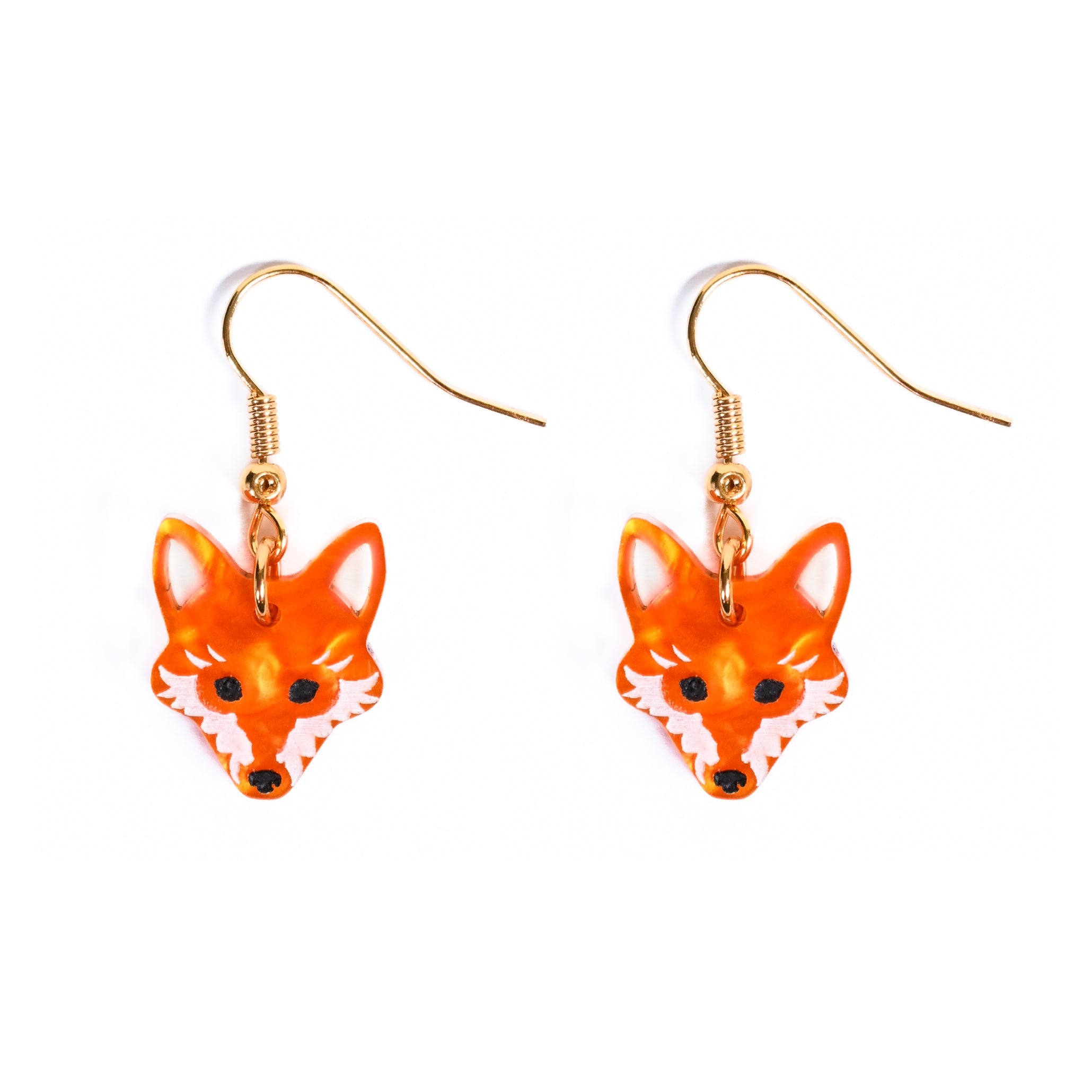 Orange fox-shaped earrings on a white background