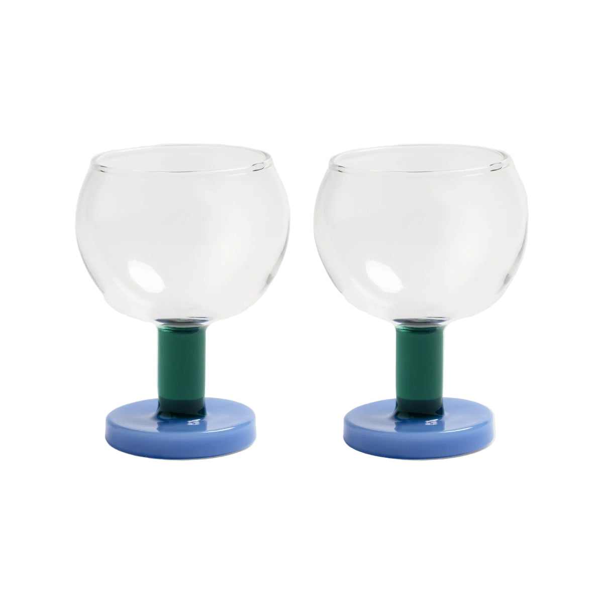 Two glass candle holders with green stems and blue bases on a white background