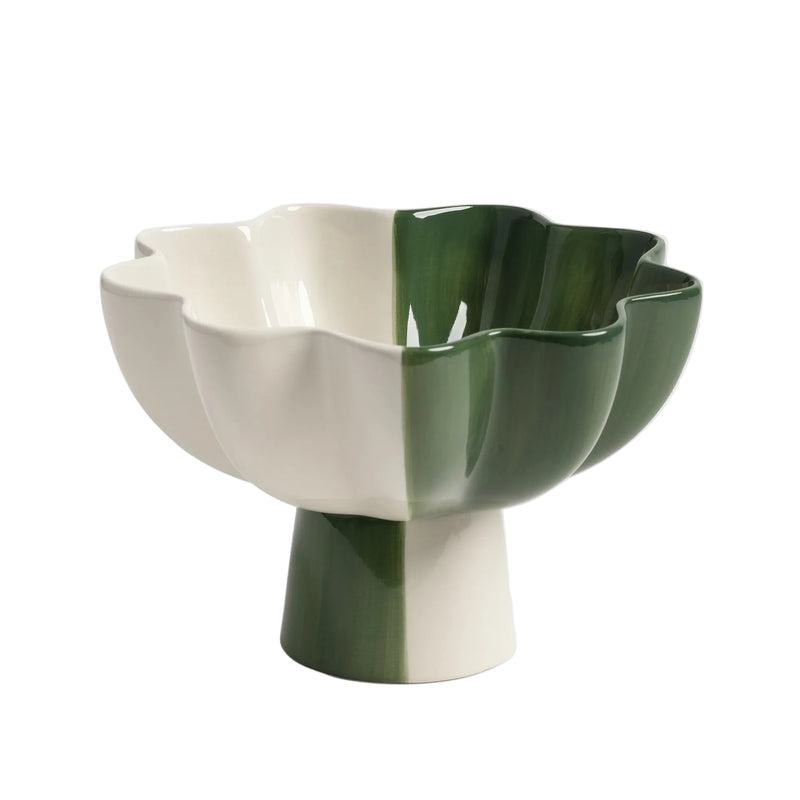 Ceramic bowl with green and white design on a light gray background