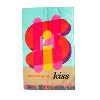 Colorful abstract designed tea towel with 'Harland Miller' and 'kiss' text on a light blue and beige background