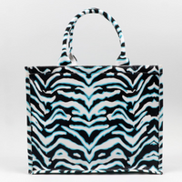 stripey tote bag on blank background